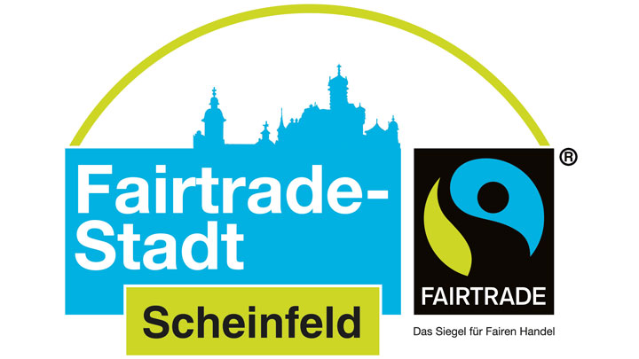 Logo 'Fairtrade-Stadt Scheinfeld' mit der blauen Silhouette der Stadt und dem offiziellen Fairtrade-Siegel.